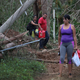 Residents walk around a roadblock caused by a mudslide in Hayales de Coama, Puerto Rico, on Sept. 24, 2017. (Joe Raedle/Getty Images)